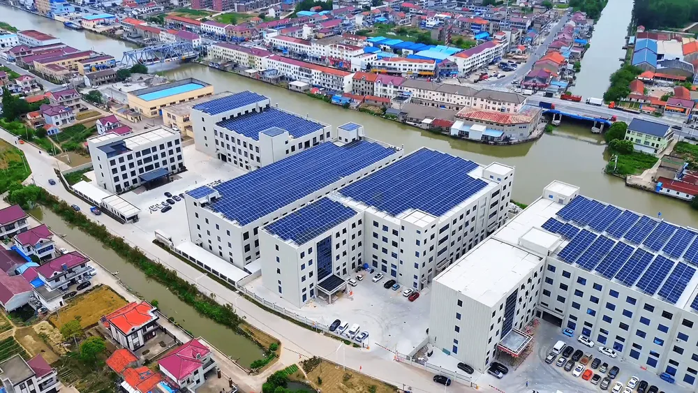 a group of buildings with solar panels on the roof