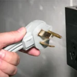 UK three-pin 240V plug beside a black power unit
