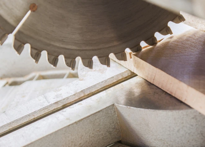 Circular saw blade cutting timber on a miter saw