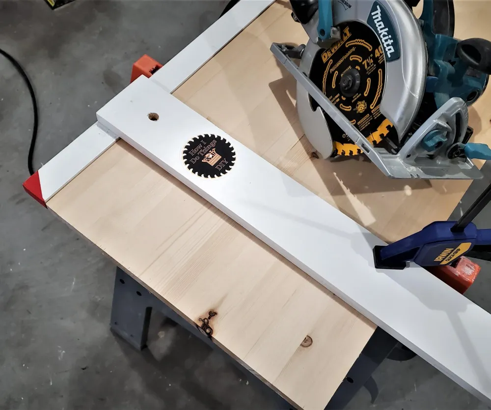 Circular saw making a guided straight cut in plywood