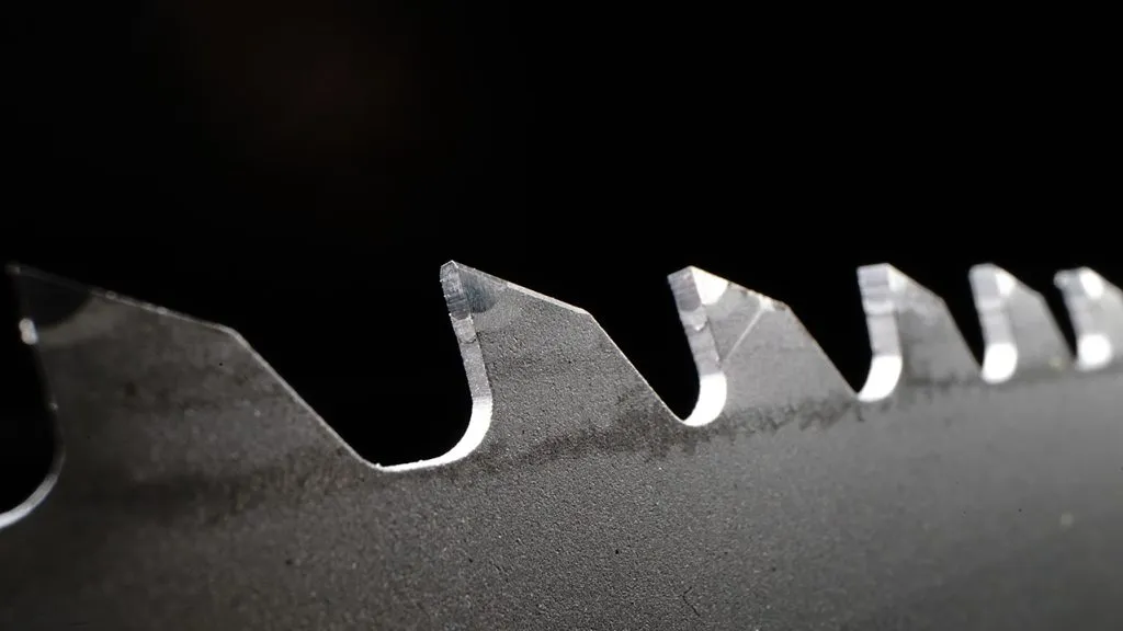 Close-up of sharp hand saw teeth