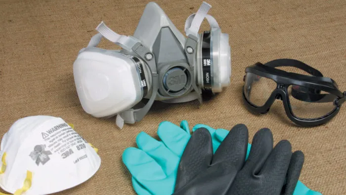 Respirator, goggles, gloves and hearing protection for hole saw work