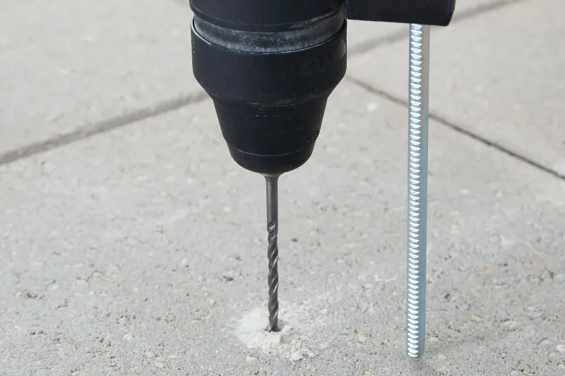 Masonry bit shown beside a fastener for dimensional comparison