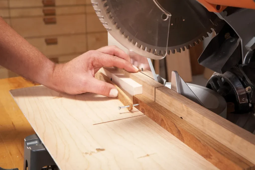 Miter saw making a straight crosscut in a wooden board