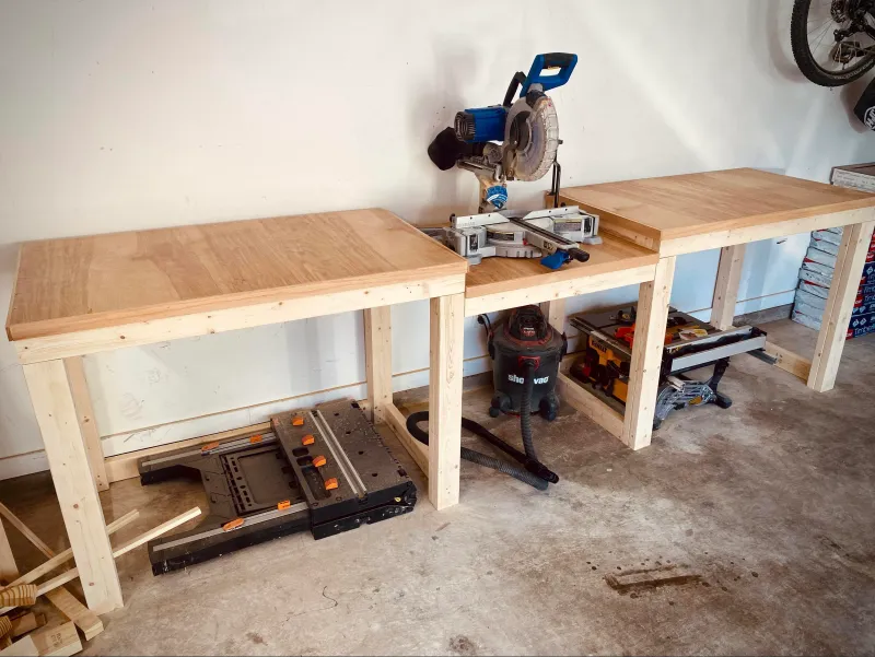 Miter saw installed at the end of a woodworking bench