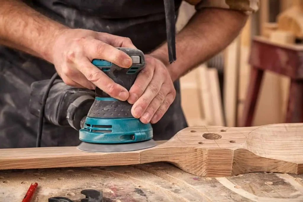 Power sanding a shaped wooden board
