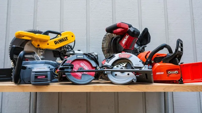Portable electric saws displayed on a workshop table