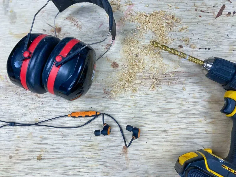 Hearing and eye protection beside power tools