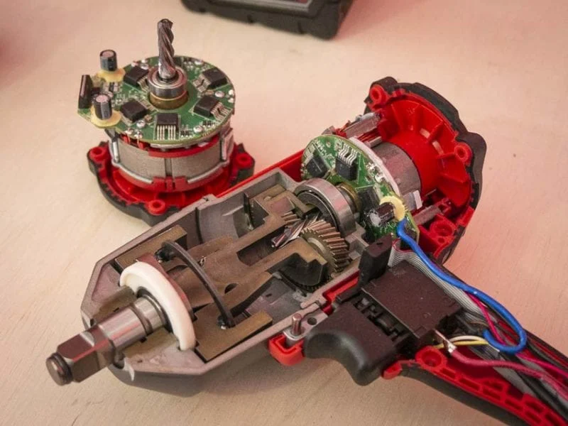 Open reciprocating saw showing its motor and drive components