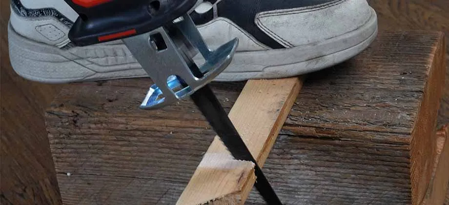 Reciprocating saw positioned at a small branch